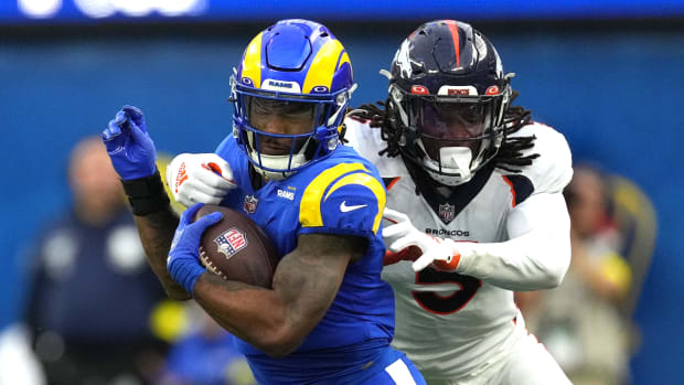 Los Angeles Rams running back Cam Akers (3) carries the ball against Denver Broncos linebacker Randy Gregory (5) in the first half at SoFi Stadium.
